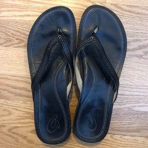 Brand new OluKai black wedged sandals